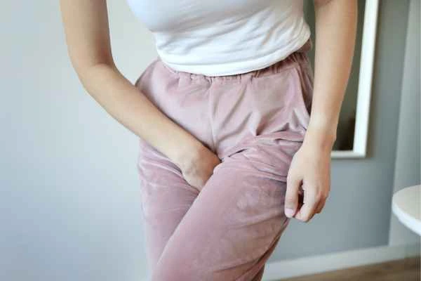 older woman running to the toilet because of urinary incontinence Greater London (Greenwich)